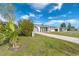 Well-maintained home with a lush landscape and spacious driveway at 20 Annapolis Ln, Rotonda West, FL 33947