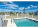 Relaxing blue swimming pool with a white fence in the background at 20 Annapolis Ln, Rotonda West, FL 33947