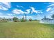 Large backyard with canal view and grassy area at 20 Annapolis Ln, Rotonda West, FL 33947