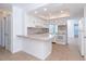 Galley kitchen with white cabinets and granite counters at 20 Annapolis Ln, Rotonda West, FL 33947