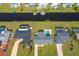 Aerial view of three canal-front homes with pools at 20 Annapolis Ln, Rotonda West, FL 33947