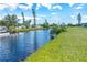 Tranquil canal-front property with lush landscaping and boat dock at 20 Annapolis Ln, Rotonda West, FL 33947