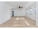 Bright living room with carpeted floors and ceiling fan at 20 Annapolis Ln, Rotonda West, FL 33947