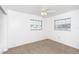 Bedroom with two windows and ceiling fan at 20 Annapolis Ln, Rotonda West, FL 33947
