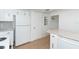 White appliances and cabinets in this kitchen at 20 Annapolis Ln, Rotonda West, FL 33947