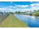 Peaceful backyard with a canal view and grassy area at 20 Annapolis Ln, Rotonda West, FL 33947
