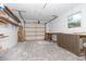 Spacious garage with workbench and ample storage shelving at 20 Annapolis Ln, Rotonda West, FL 33947