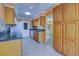 Kitchen with wood cabinets, and dark countertops at 612 Deerwood Ave # 169, Englewood, FL 34223