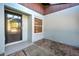 Front entry with a door and a window, tiled flooring at 612 Deerwood Ave # 169, Englewood, FL 34223