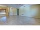 Living area with tile flooring, ceiling fan, and access to other rooms at 612 Deerwood Ave # 169, Englewood, FL 34223