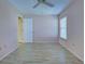 Spacious bedroom with light pink walls and wood-look floors at 612 Deerwood Ave # 169, Englewood, FL 34223