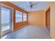 Bright sunroom with tile floors, and view to backyard at 612 Deerwood Ave # 169, Englewood, FL 34223