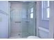 Walk-in shower with tiled walls and glass enclosure at 612 Deerwood Ave # 169, Englewood, FL 34223