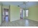 Spacious bedroom with wood-look floors and access to bathroom at 612 Deerwood Ave # 169, Englewood, FL 34223