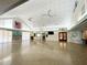 Large community room featuring a fireplace and kitchen area at 612 Deerwood Ave # 169, Englewood, FL 34223