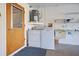 Laundry room with washer, dryer, and utility sink at 612 Deerwood Ave # 169, Englewood, FL 34223