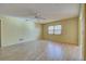 Large living room with tile floors and a ceiling fan at 612 Deerwood Ave # 169, Englewood, FL 34223