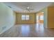 Spacious living room featuring tile floors and a ceiling fan at 612 Deerwood Ave # 169, Englewood, FL 34223