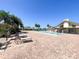 Community pool with lounge chairs and brick patio at 612 Deerwood Ave # 169, Englewood, FL 34223