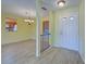 Light yellow dining room with tile floors and chandelier at 612 Deerwood Ave # 169, Englewood, FL 34223