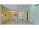 Bright living room with tile flooring, ceiling fan, and views to other rooms at 612 Deerwood Ave # 169, Englewood, FL 34223