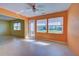 Sunroom with tile floors and access to backyard at 612 Deerwood Ave # 169, Englewood, FL 34223