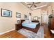 Main bedroom with hardwood floors and access to en-suite bathroom at 10 Boca Royale Blvd, Englewood, FL 34223