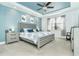 Light-filled main bedroom with a large window, carpet floors, and light blue walls at 13092 Rinella St, Venice, FL 34293