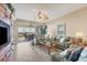 Spacious living room with light-colored sofas and access to a balcony at 13313 Gasparilla Rd # C205, Placida, FL 33946