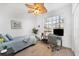 Cozy bedroom featuring a twin-size bed and workspace at 13313 Gasparilla Rd # C205, Placida, FL 33946