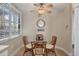 Cozy breakfast nook with glass table and wicker chairs, perfect for morning coffee at 13313 Gasparilla Rd # C205, Placida, FL 33946