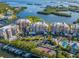 Aerial view of waterfront community with tennis court and pool at 13313 Gasparilla Rd # C205, Placida, FL 33946