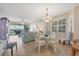 Charming dining room with glass table and four chairs at 13313 Gasparilla Rd # C205, Placida, FL 33946