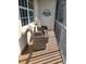 Peaceful balcony featuring wicker chairs and coastal decor at 13313 Gasparilla Rd # C205, Placida, FL 33946