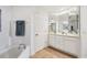 Bright bathroom with double vanity, separate shower and tub, and updated fixtures at 13313 Gasparilla Rd # C205, Placida, FL 33946