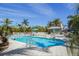 Community pool with lounge chairs and gazebo at 13313 Gasparilla Rd # C205, Placida, FL 33946
