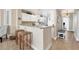 Kitchen with white cabinets, breakfast bar and stainless steel appliances at 13313 Gasparilla Rd # C205, Placida, FL 33946