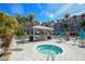 Relaxing spa and patio area with grill, seating, and lush landscaping at 13313 Gasparilla Rd # C205, Placida, FL 33946