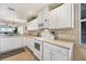 Bright kitchen with white cabinets, updated countertops, and modern appliances at 13313 Gasparilla Rd # C205, Placida, FL 33946