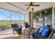 Relaxing screened lanai with wicker furniture at 13313 Gasparilla Rd # C205, Placida, FL 33946