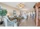 Open living room with light teal sofas and a view to the dining room and kitchen at 13313 Gasparilla Rd # C205, Placida, FL 33946