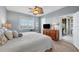 Spacious main bedroom with water view, large bed, and private balcony access at 13313 Gasparilla Rd # C205, Placida, FL 33946