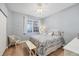 Guest bedroom with queen bed, ceiling fan, and hardwood floors at 13313 Gasparilla Rd # C205, Placida, FL 33946