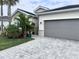 This home boasts an attached two-car garage, complimented by well-manicured landscaping at 19060 Moscato Ct, Venice, FL 34293