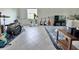 Spacious bonus room decorated with musical instruments, plants and stylish furniture at 19060 Moscato Ct, Venice, FL 34293
