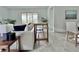 Bright living room with tile floors, sliding glass doors to outside, and modern decor at 19060 Moscato Ct, Venice, FL 34293