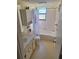 Clean bathroom with a tub shower, toilet and vanity at 26 Quails Run Blvd # 7, Englewood, FL 34223