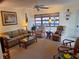 Relaxing living room with comfortable seating and a coffee table at 26 Quails Run Blvd # 7, Englewood, FL 34223