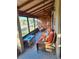 Peaceful screened porch with wicker furniture at 26 Quails Run Blvd # 7, Englewood, FL 34223