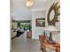 Bright and spacious entryway with tile flooring, decorative console table, and views to the living room at 2619 Wax Myrtle Ct, Port Charlotte, FL 33953